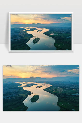 傍晚夕阳洒落下的蜿蜒河流与远山城市全景