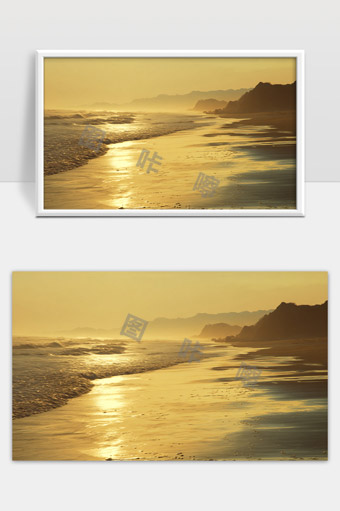 金色夕阳下宁静海滩和远山轮廓美景